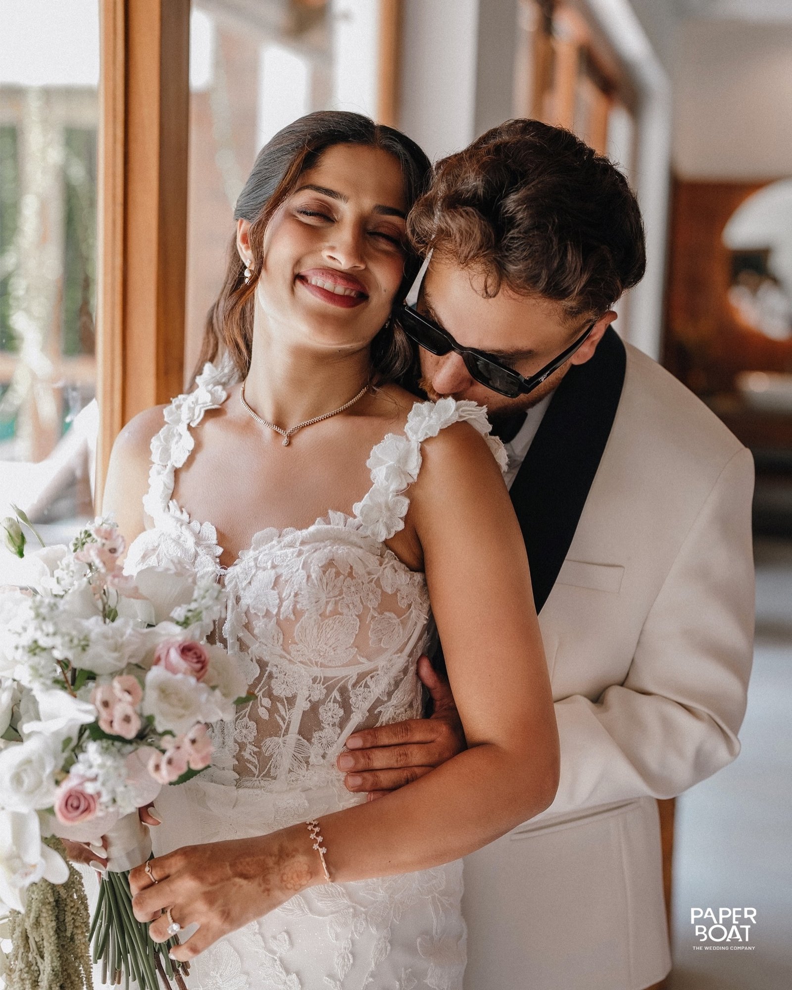A newlywed couple sharing a joyful embrace
