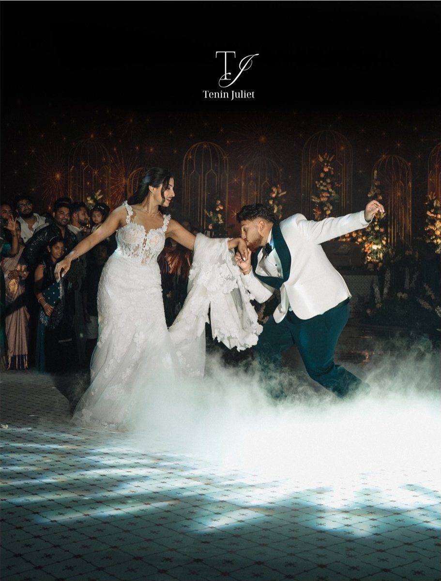 A bride making her entrance beneath sparkling lights